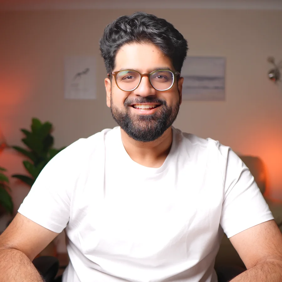 Rav Sawhney smiling, in a white T-shirt