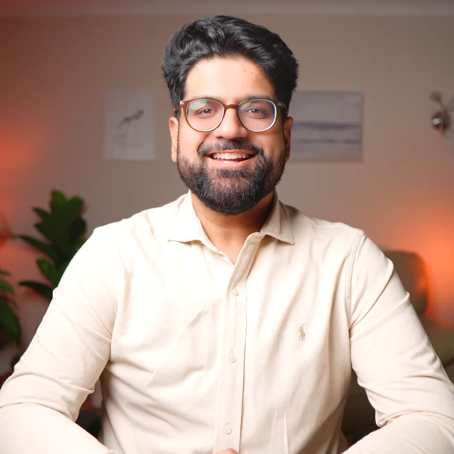 Rav Sawhney smiling, in a cream shirt